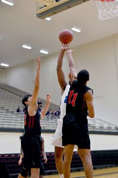 Young athletes making great basketball plays during a game. Slam Dunks and layups