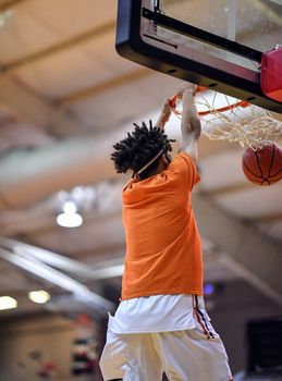 Young athletes making great slam dunks and lay ups during a basketball game