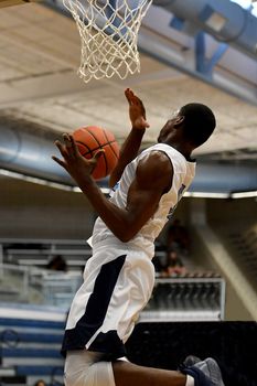 Young athletes making great basketball plays during a game. Slam Dunks and layups