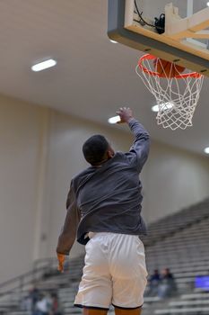 Young athletes making great basketball plays during a game. Slam Dunks and layups