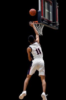 Young athletes making great basketball plays during a game. Slam Dunks and layups