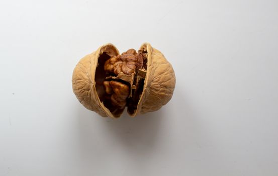 Cracked walnuts isolated on white background