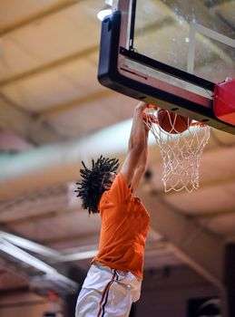 Young athletes making great slam dunks and lay ups during a basketball game