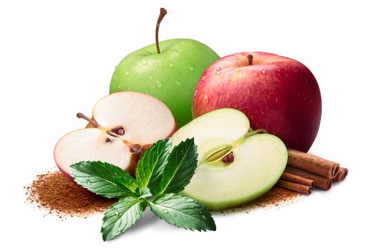 Mint, whole and halved red and green apples next to piles of cinnamon, in sticks and ground. Clipping paths, shadow separated