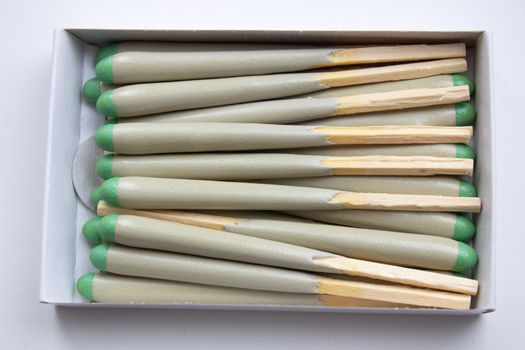 Hunting waterproof matches in a paper box isolated on white background.