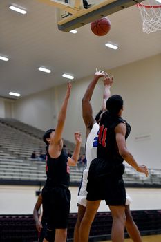 Young athletes making great basketball plays during a game. Slam Dunks and layups