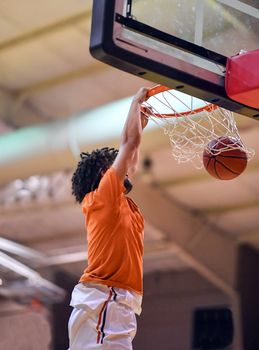 Young athletes making great slam dunks and lay ups during a basketball game