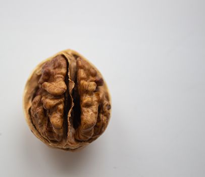 Cracked walnuts isolated on white background