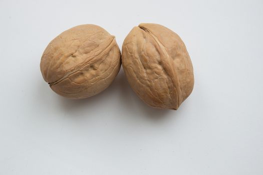 Cracked walnuts isolated on white background
