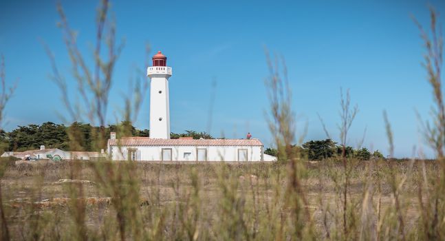 Port Joinville, France - September 17, 2018 - Architectural detail of the Corbeaux Marine Lighthouse on a summer day