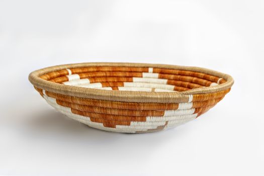 Wicker basket to arrange fruits and vegetables on a table.