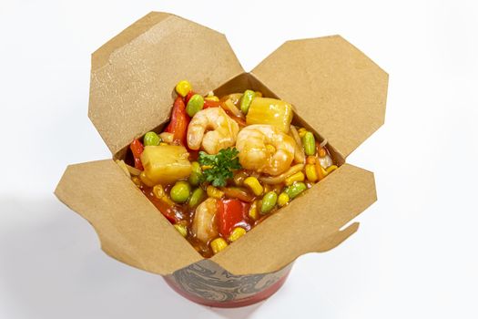 Box of stir fried chicken and shrimps noodle served in a paper box for take away