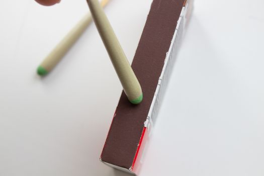 Hunting waterproof matches in a paper box isolated on white background.