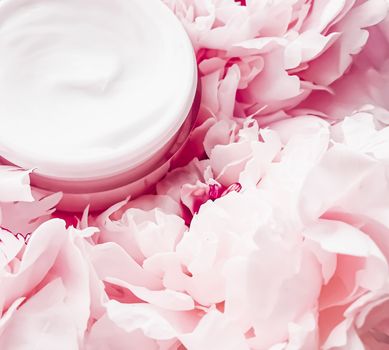 Face cream moisturizer on floral background as luxury skincare cosmetics, healthcare and beauty product concept