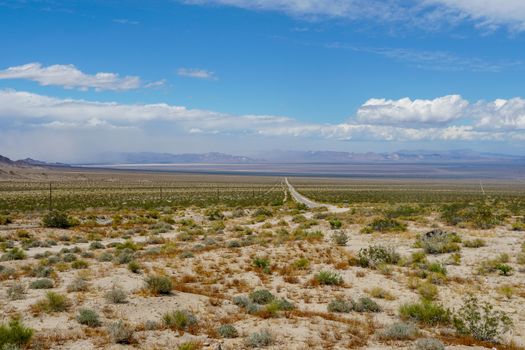 Endless desert road. Long straight road in desert. Adventure travel in a desert. California. USA