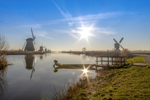 Twight light sunrise on the Unesco heritage windmill silhouette at the middle of the canal, Alblasserdam, Netherlands