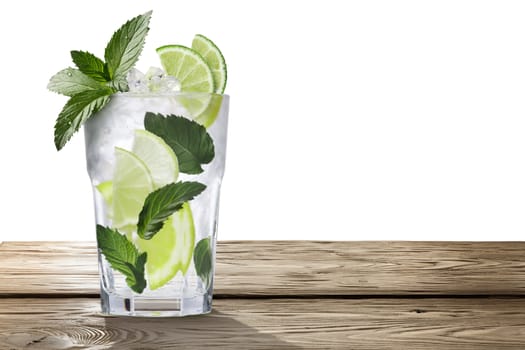 Mojito (alcoholic cocktail with rum, lime and mint) on wooden table. Clipping paths, infinite depth of field