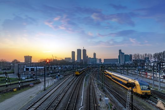 The Hague (Den Haag in Dutch) skyline during the sunset moment behind the train station