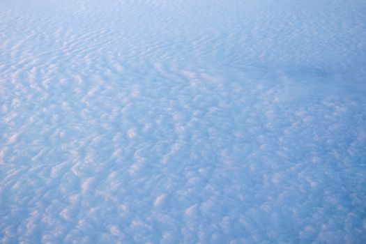 Wide cloud landscape aerial view from a plane.