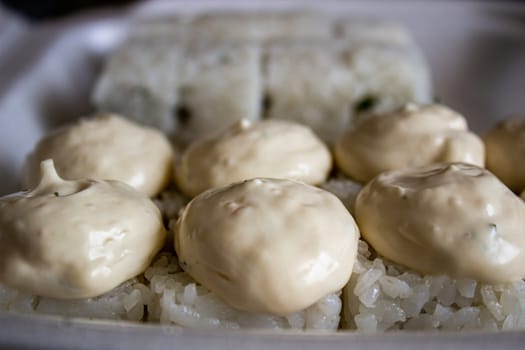 Different sushi in a take-away package. Japanese food.