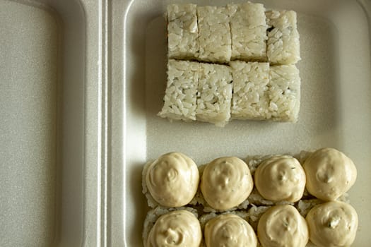 Different sushi in a take-away package. Japanese food.