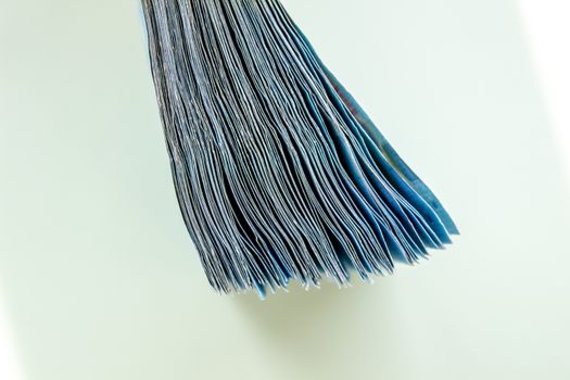 A bundle of 20 Euro banknotes and coins on a light background