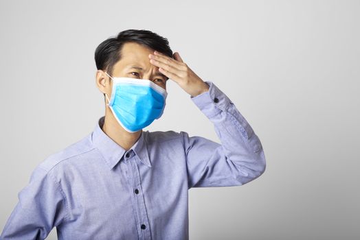 adult asia man wearing surgical mask covering mouth and nose with illness symptom flu.