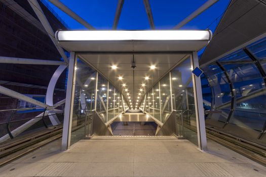 Beatrixkwartier (Beatrix district in Dutch) entrance East escalator getting out from tramway station in The Hague at night, Netherlands