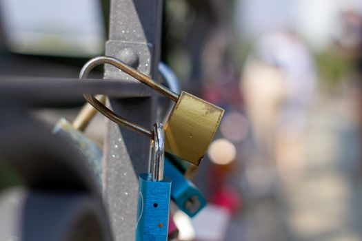 Padlocks on a bridge in Frankfurt am main, Germany. The ritual of attaching padlocks as a symbol of love to a bridge has been common in Europe since the 2000s.