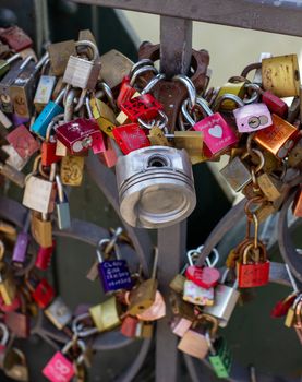 Padlocks on a bridge in Frankfurt am main, Germany. The ritual of attaching padlocks as a symbol of love to a bridge has been common in Europe since the 2000s.