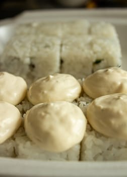 Different sushi in a take-away package. Japanese food.