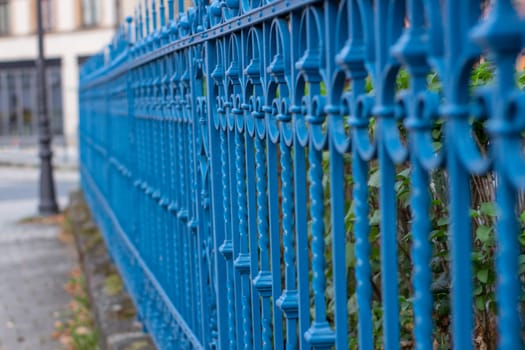 Blue metal fence in the city, Germany