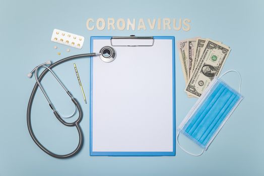 medical equipment mockup clipboard with stethoscope and drug, surgical mask on blue background. corona virus concept.