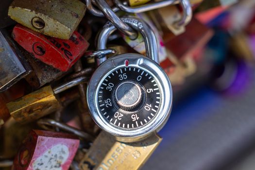 Padlocks on a bridge in Frankfurt am main, Germany. The ritual of attaching padlocks as a symbol of love to a bridge has been common in Europe since the 2000s.