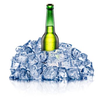 Green beer bottle, cooling down in a rough crushed ice. Clipping paths