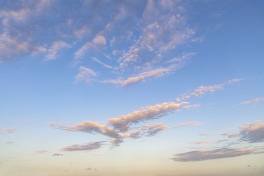 Group of clouds floating in the blue cyan pur gradient color sky at the early sunset moment