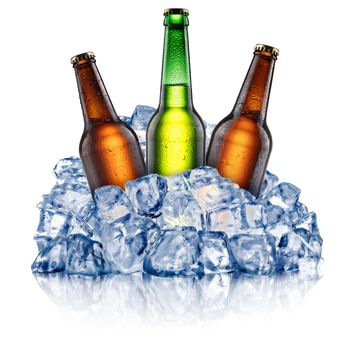 Green and brown beer bottles, cooling down in a rough crushed ice. Clipping paths