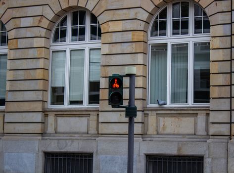 Traffic light for cyclists. Red light for bycicle lane on a traffic light. Traffic light in red for cyclists, with the figure of a cyclist