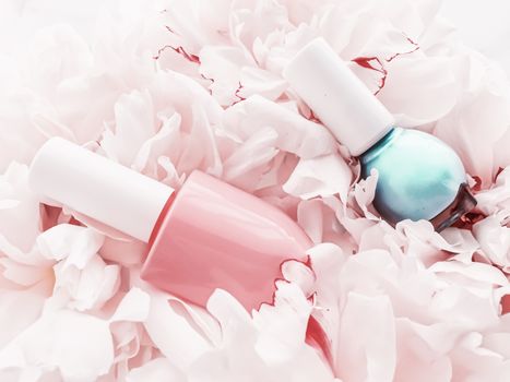 Nail polish bottles on floral background, french manicure and cosmetic branding design