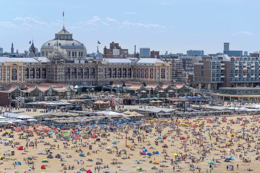 SCHEVENINGEN, 2 June 2019 - Aerial view of the beach of The Hague with crowded people enjoying take sun bath during the hot and sunny day before the summer.