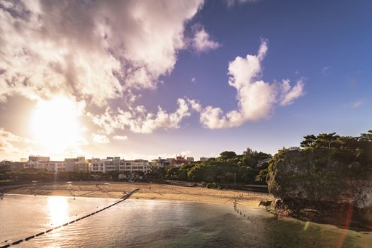 Sunrise landscape of the Shinto Shrine Naminoue at the top of a cliff overlooking the beach and ocean of Naha in Okinawa Prefecture, Japan.