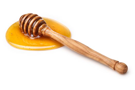 Wooden honey dipper with honey. Infinite depth of field,clipping paths