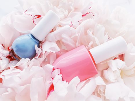 Nail polish bottles on floral background, french manicure and cosmetic branding design