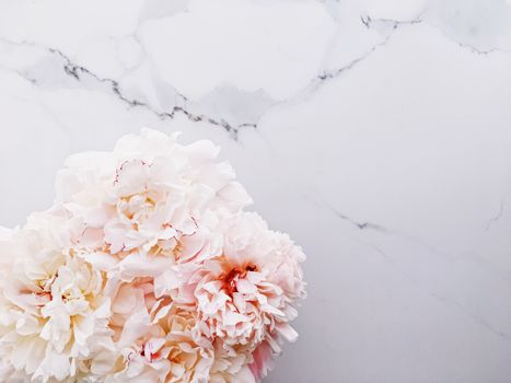 Bouquet of peony flowers on luxury marble background, wedding flatlay and event branding design