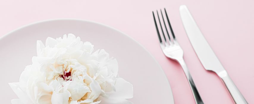 Dining plate and cutlery with peony flower as wedding decor set on pink background, top tableware for event decoration and dessert menu design