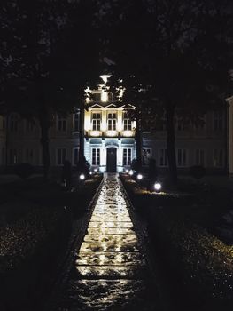 Exterior facade of classic building in the European city at night, architecture and design detail