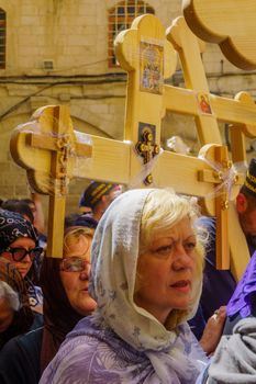 Jerusalem, Israel - April 6, 2018: Orthodox good Friday scene in the entry yard of the church of the holy sepulcher, with pilgrims. The old city of Jerusalem, Israel