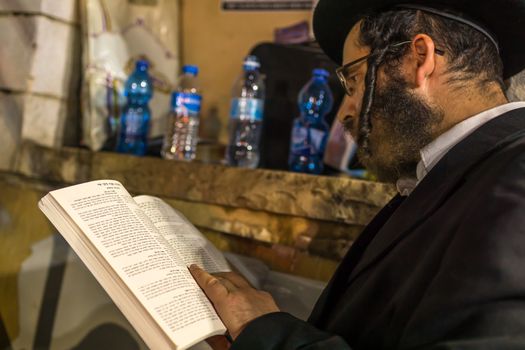 MERON, ISRAEL - MAY 03, 2018: Orthodox Jewish man takes part in the annual hillula of Rabbi Shimon Bar Yochai, in Meron, Israel, on Lag BaOmer Holiday