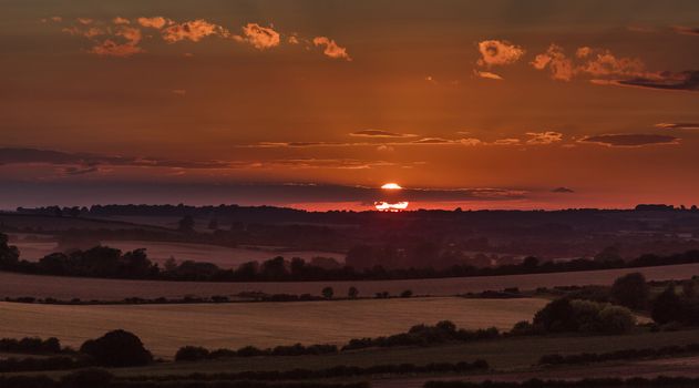 Near Belchford, Lincolnshire, UK, July 2017, Sunset View of Lincolnshire Wolds near Belchford and the Bluestone Heath Road