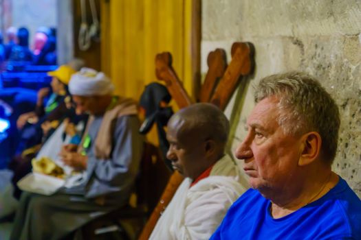 Jerusalem, Israel - April 6, 2018: Orthodox good Friday scene in the church of the holy sepulcher, with pilgrims. The old city of Jerusalem, Israel